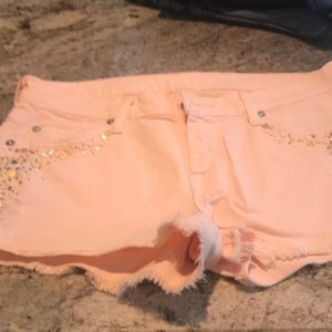 Peach colored denim shorts